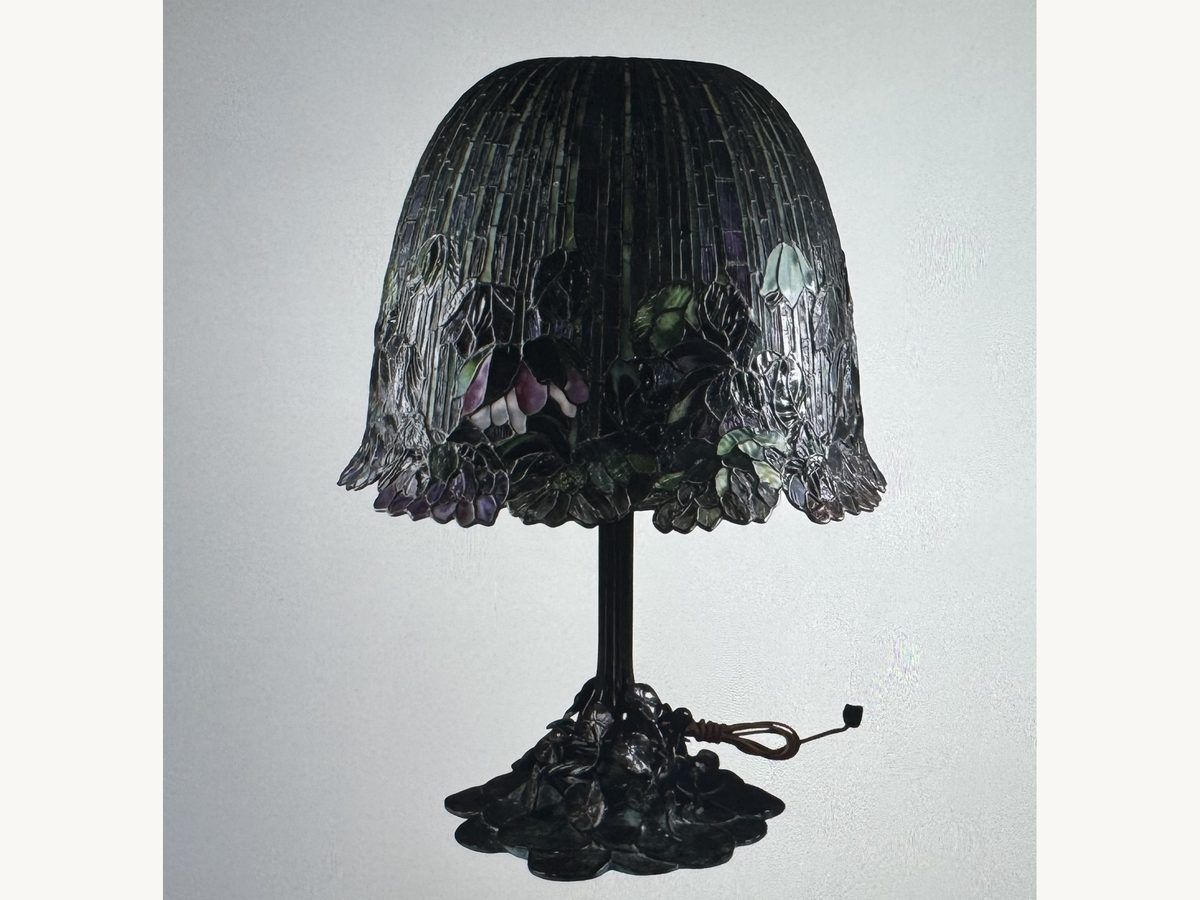 Buffalo Studios bronze table lamp with a leaded-glass shade of purple and green blossoms