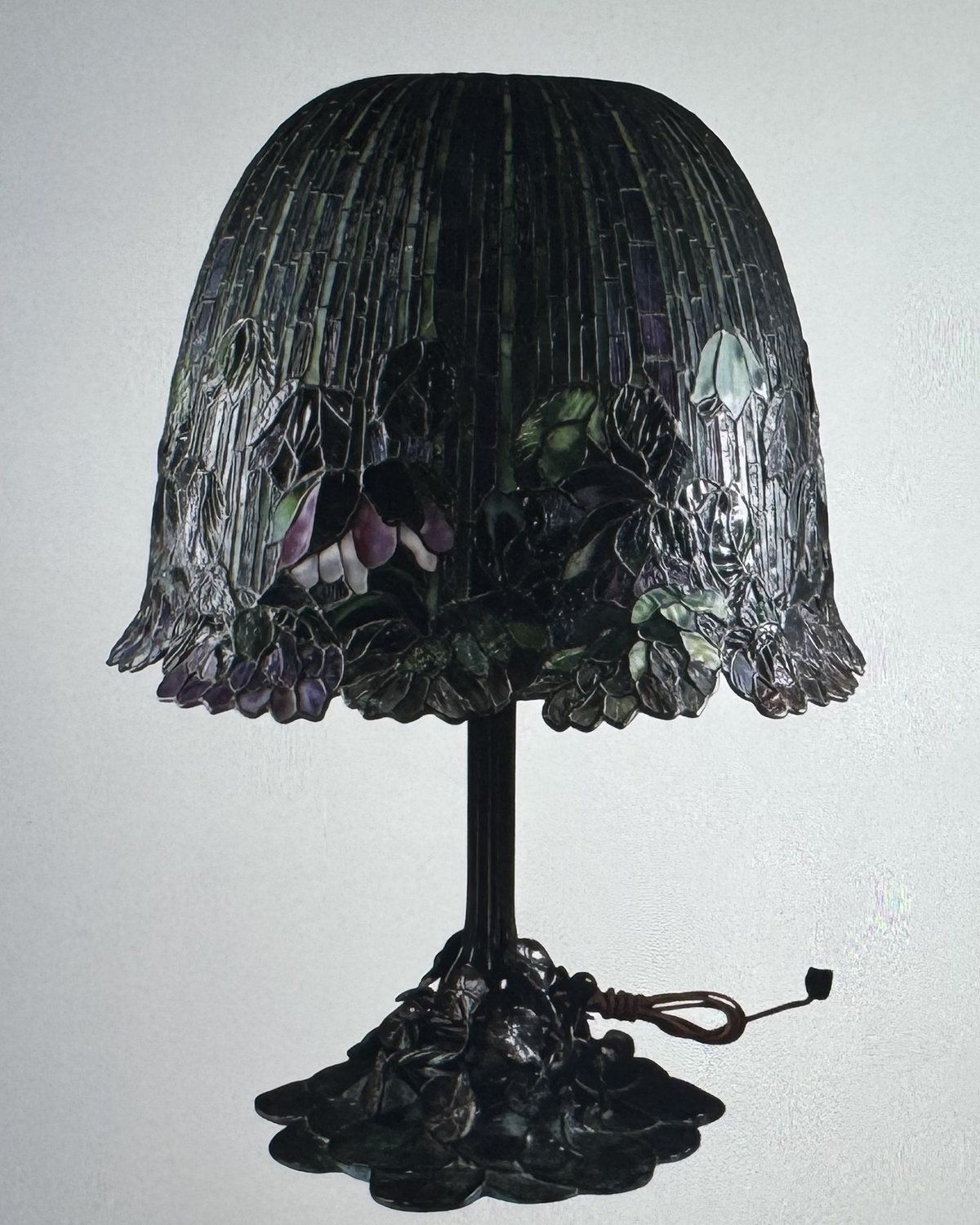 Buffalo Studios bronze table lamp with a leaded-glass shade, sold at auction for $30,000