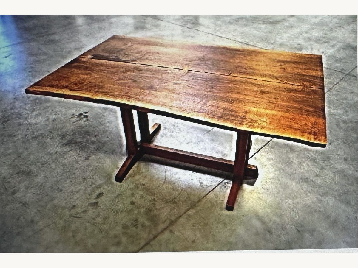 George Nakashima Frenchman's Cove walnut dining table on a trestle base