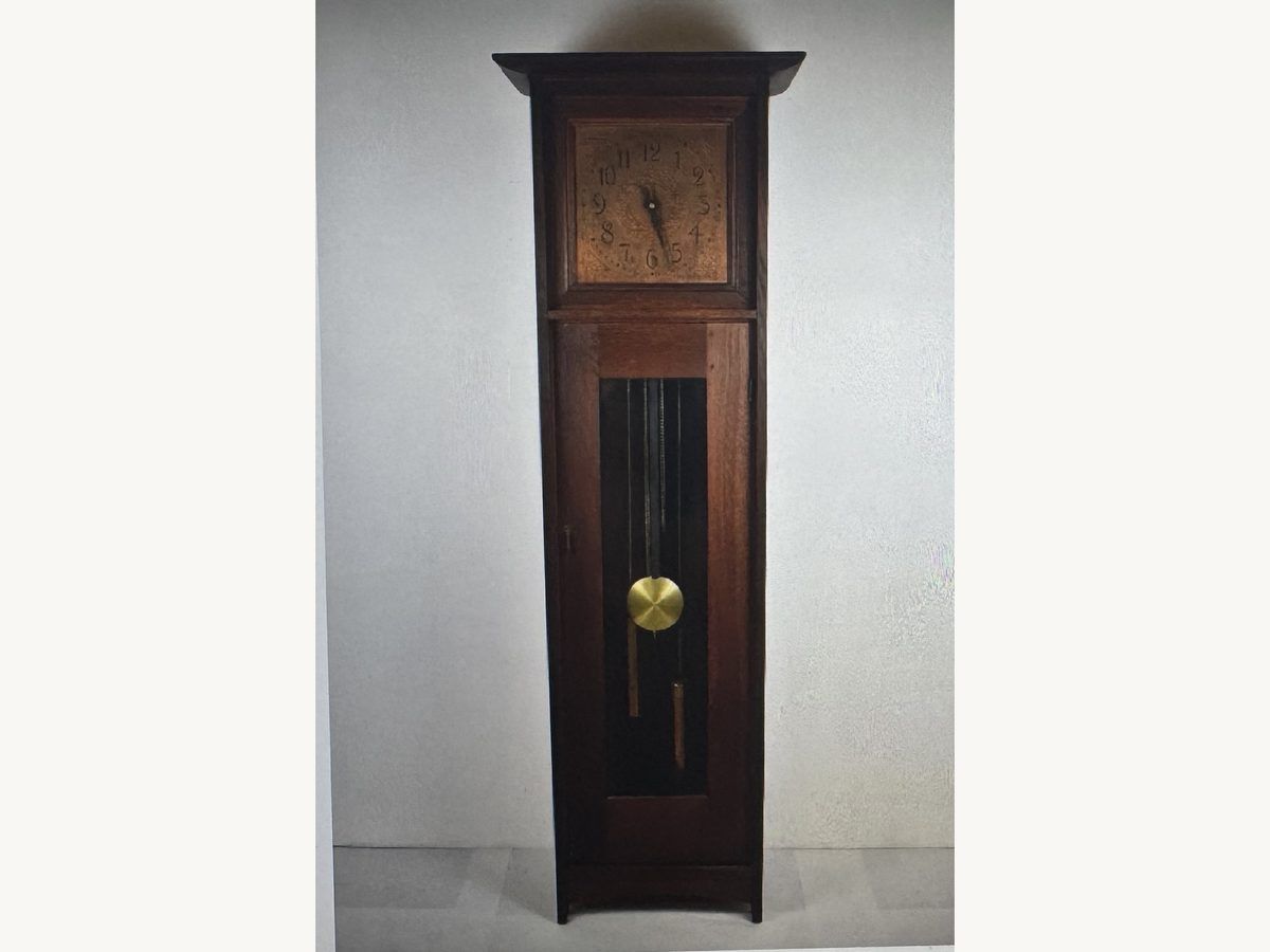Signed L. and J.G. Stickley Arts and Crafts oak grandfather clock with a brass pendulum